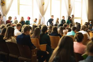 Young youth teenagers attending a community gathering event.